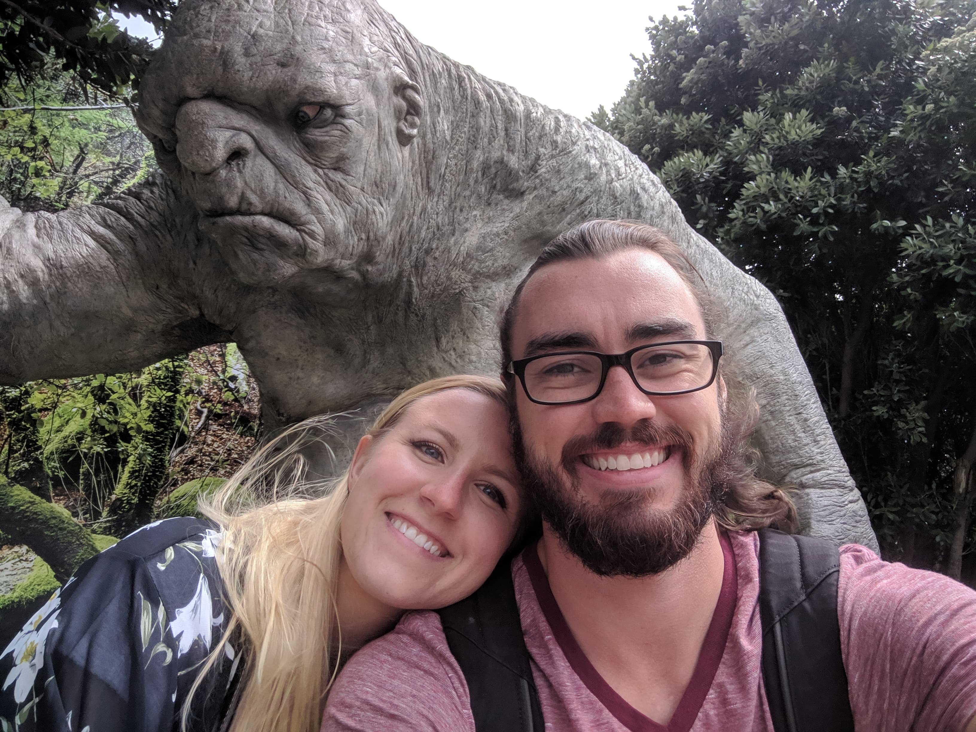 Lauren and Gerrod hanging out with a troll in front of Weta Workshop